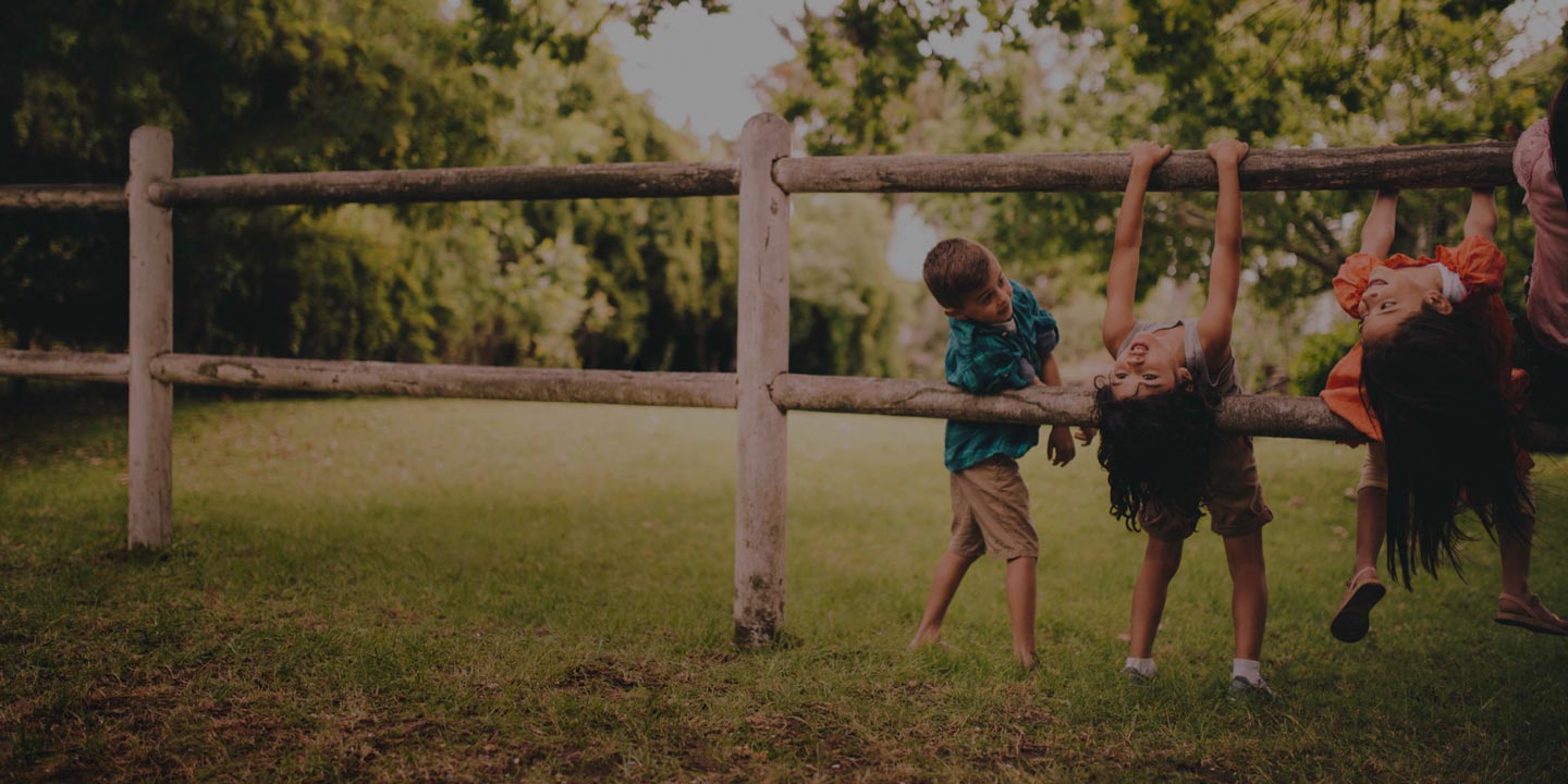 Kids Playing on Fence