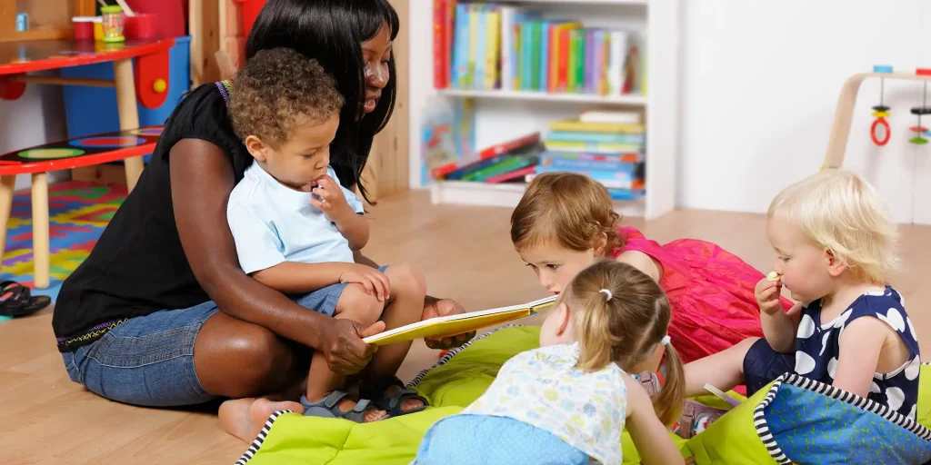 Woman reading a book to children